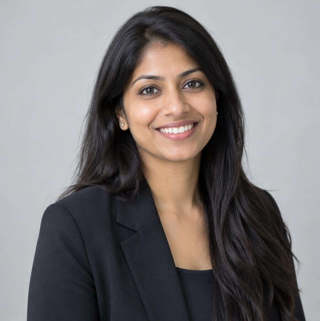 Portrait of a smiling woman engineer in a studio